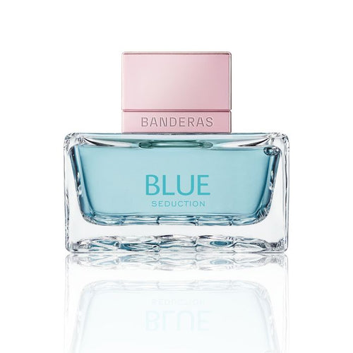 Thick glass perfume bottle with blue juice and rose cap on a white background