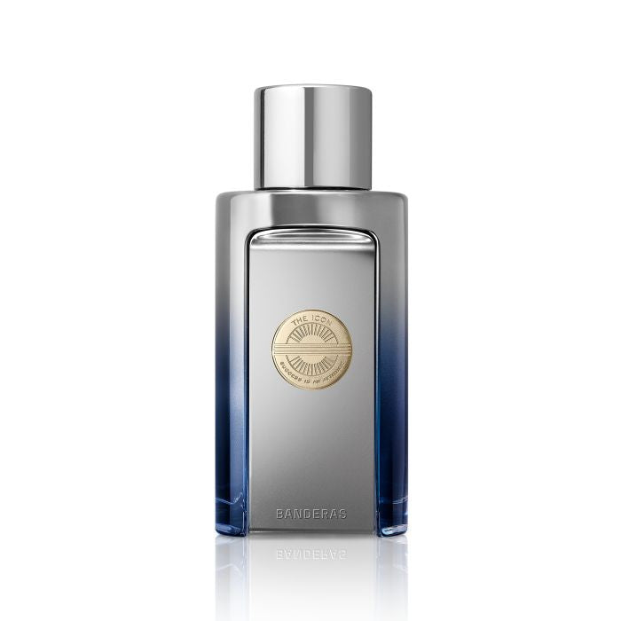 Icon Elixir Fragrance for him by Banderas. Silver and Blue Perfume Bottle with gold detail on White background