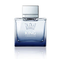 Banderas King of Seduction perfume presented in a clear blue-tinted glass bottle with a metallic cap, displayed on a clean white background