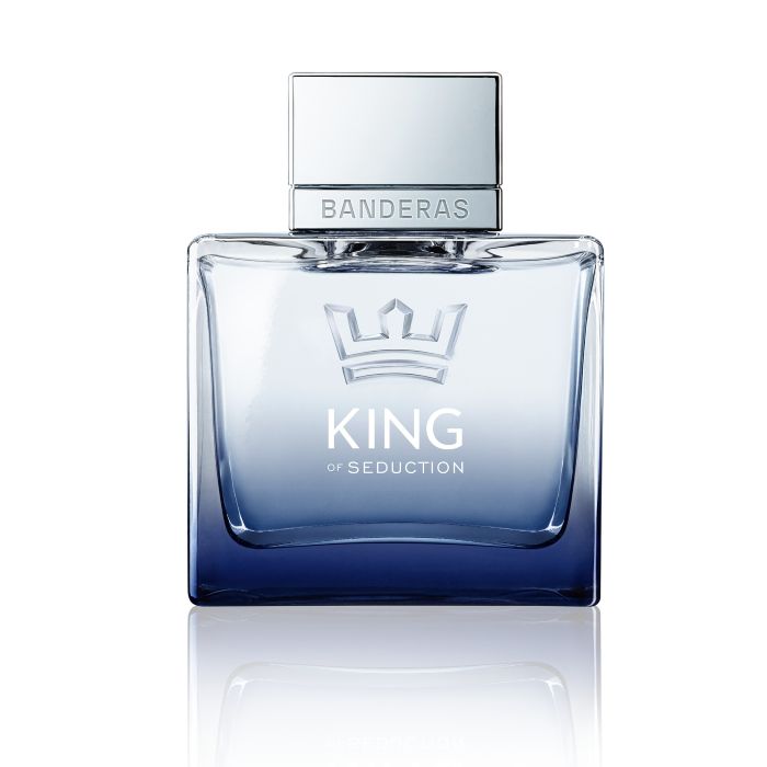 Banderas King of Seduction perfume presented in a clear blue-tinted glass bottle with a metallic cap, displayed on a clean white background
