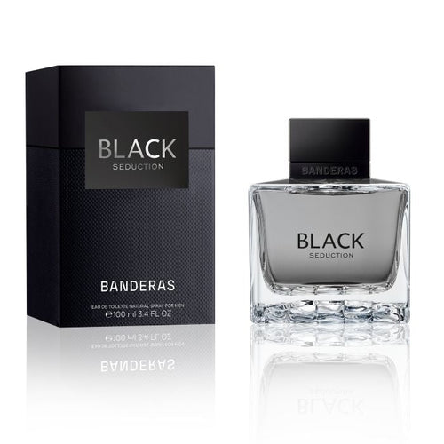 Banderas Seduction perfume in a sleek black glass bottle with a matching black cap, displayed alongside its black textured packaging box with silver writing on a clean white background.