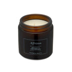 Brighton Beard Brown Candle in glass container against a white background     