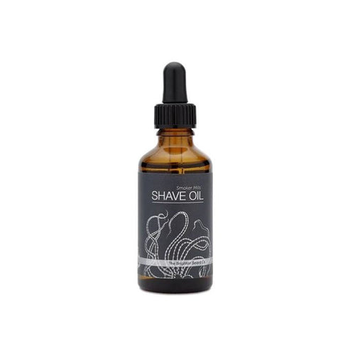 Brighton Beard Shave Oil bottle with minimalist label design, inlcluding nautical octopus motif, shown against a clean white background—premium grooming oil for a smooth shave, featuring sleek amber glass packaging and a dropper cap.