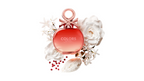 Perfume bottle labeled 'COLORS' surrounded by white flowers and decorative elements on a white background
