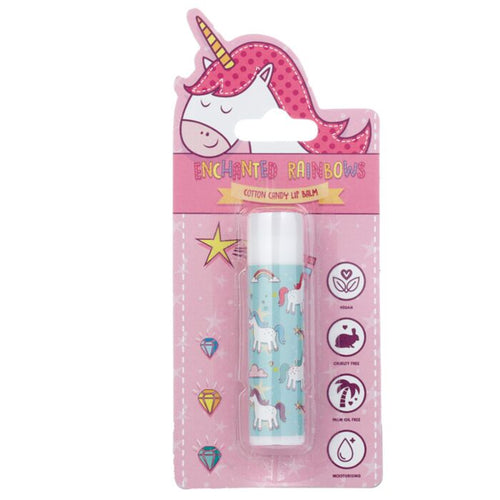 Enchanted Rainbows Lipbalm in stick container with blue background and unicorns and rainbows on the foreground. Packaged in pink packaging with unicorn motif