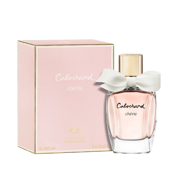 Grès Cabochard Chérie perfume bottle with a chic, modern design featuring soft pink glass, a stylish satin bow, and a sleek silver cap—elegant fragrance packaging combining feminine charm with contemporary French sophistication