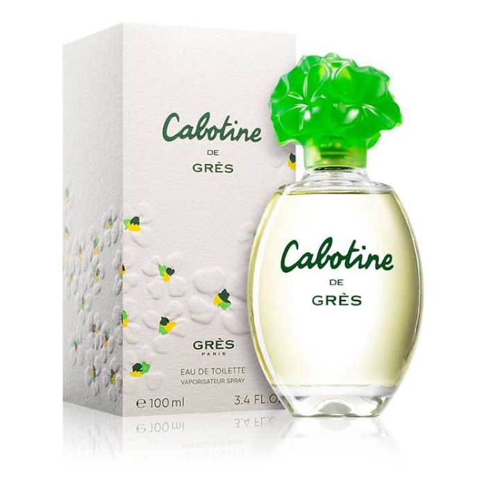 Grès Cabotine perfume set featuring the signature green floral perfume bottle alongside a decorative box with colorful flower prints—elegant fragrance packaging combining fresh, feminine design with classic French style.