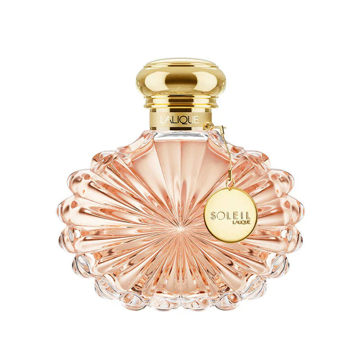 Perfume bottle with gold cap and 'Soleil' label on a white background