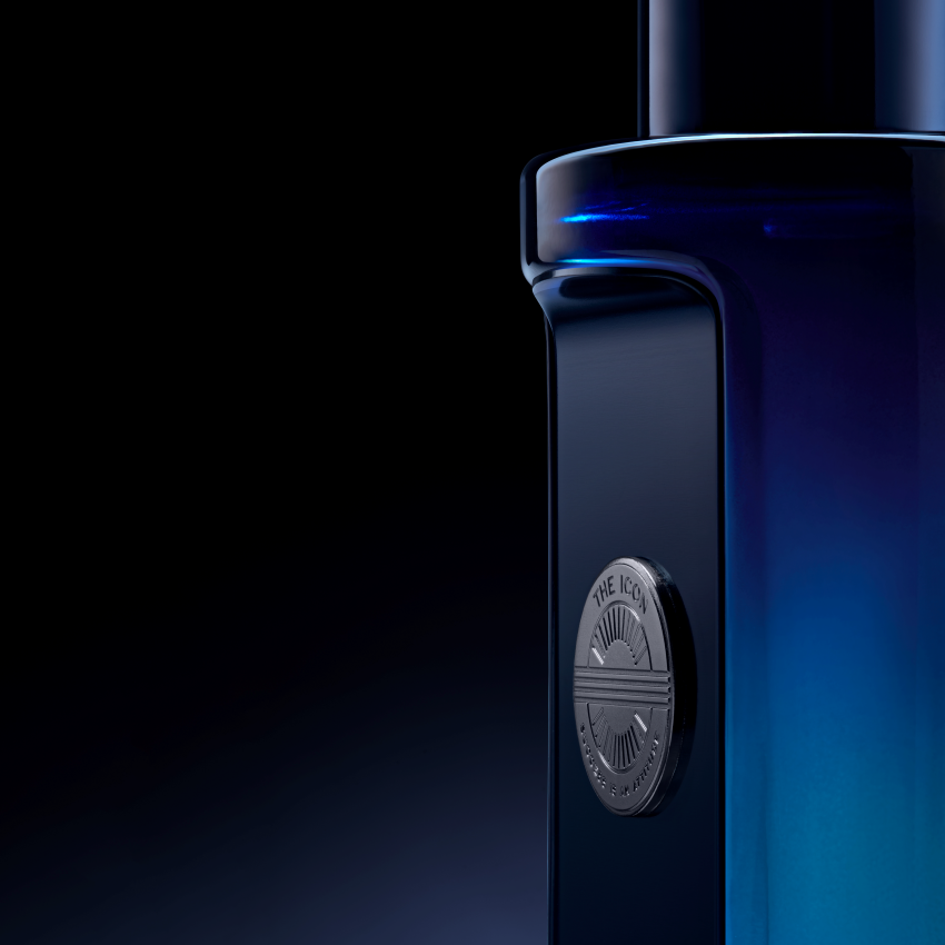 Close-up of a blue electronic device with a brand logo on a dark background